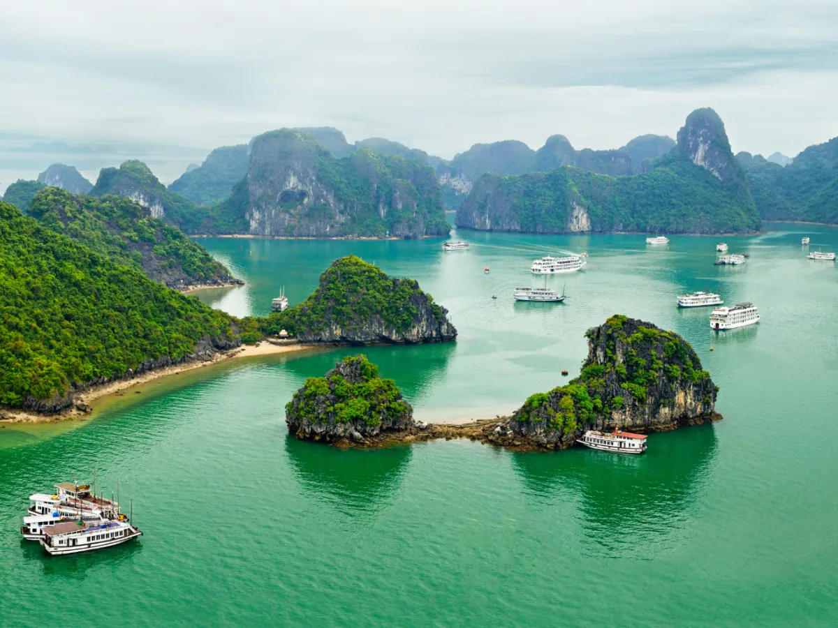 Limestone islands and cruise boats in Halong Bay, Vietnam