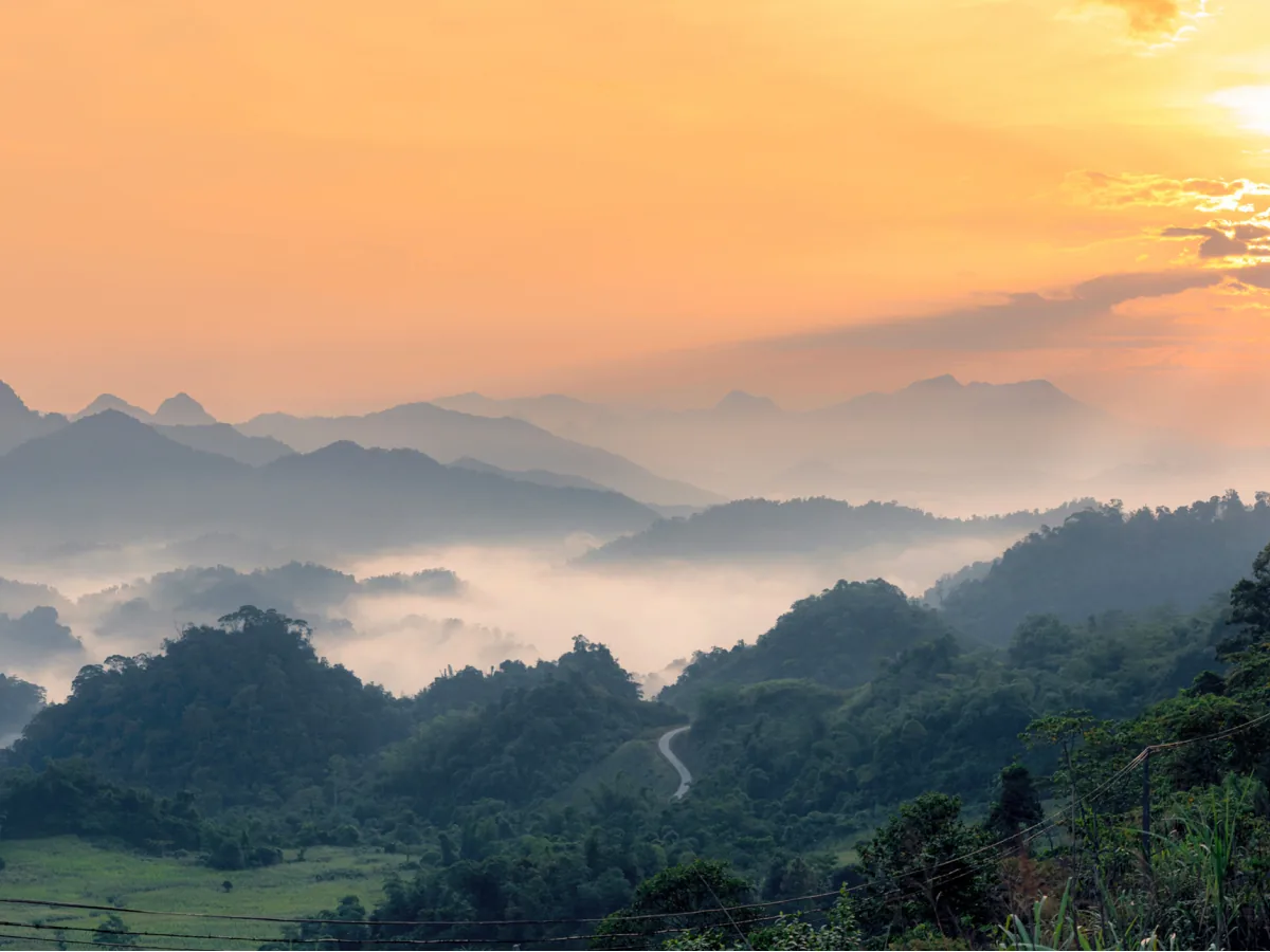 Misty mountains at sunset in Mai Chau valley, Northern Vietnam